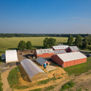 Aerial View of Rolling Fields Tree Farm, Largest Suppllier of Green Giant Arborvitae in the Mid-Atlantic. Several large barns and greenhouses beside open fields